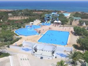 an overhead view of a pool at a resort at Holiday Home Happy Premium by Interhome in Torre Santa Sabina