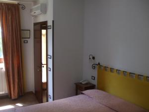 Postel nebo postele na pokoji v ubytování Camere Ramaccia