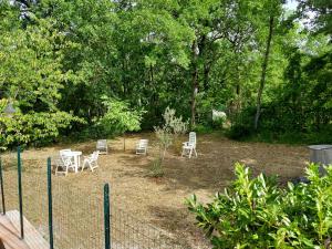 a group of chairs and tables in a yard at Villa Angela Santa Maria del Molise in Santa Maria del Molise