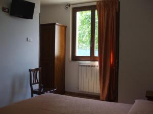 Postel nebo postele na pokoji v ubytování Camere Ramaccia