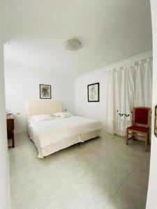 Un pat sau paturi într-o cameră la Mision Costa
