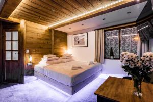 Posteľ alebo postele v izbe v ubytovaní Apartamenty Szymaszkowa