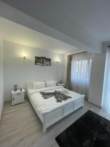 Katil atau katil-katil dalam bilik di Deny's Apartament