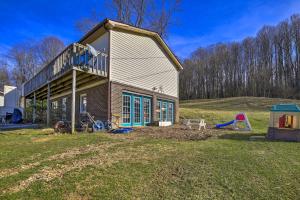 a house with a balcony and a playground at Pet-Friendly Home with Grill and Farm in Meadowview! in Meadowview