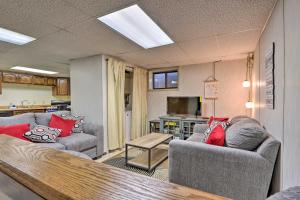 a living room with two couches and a kitchen at Lebanon Apartment with Shared Fishing Pond in Lebanon