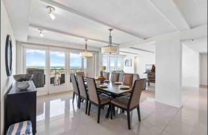 a dining room with a table and chairs at Bahia Mar Solare Tower 6th floor Oceanview Condo 3bd 3ba w Pools Hot Tubs in South Padre Island