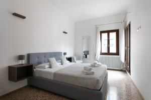 Postel nebo postele na pokoji v ubytování Residenza Pomponi Deluxe
