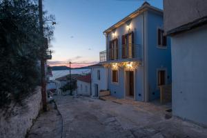 a blue and white house with lights on it at Blue Sky House in Pylos
