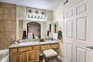 a bathroom with a sink and a large mirror at Seasonal Pool and Spa Las Vegas Pad, 11 Mi to Strip in Las Vegas +16 photos