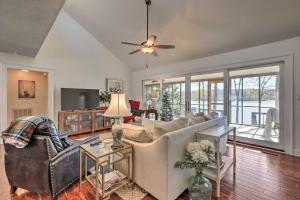 a living room with a couch and a ceiling fan at Pet-Friendly Lake Sinclair Home with Boat Dock! in Eatonton