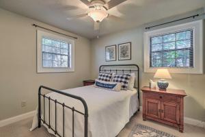 a bedroom with a bed and a ceiling fan at Pet-Friendly Lake Sinclair Home with Boat Dock! in Eatonton