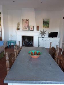 a dining room with a table with a bowl on it at Casa rural La Vega in Cazalla de la Sierra