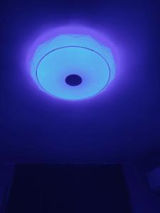 a blue light on top of a ceiling at Vanilla Ice apartment in Varna City