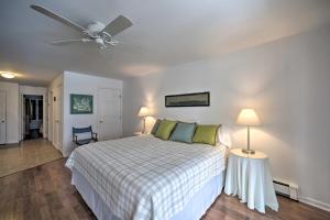 a bedroom with a bed and a ceiling fan at Bolton Landing Suite with Deck, Lake George Access in Bolton Landing