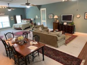 a living room with a couch and a table at Full Circle Farm Inn in Franklin