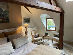 Posezení v ubytování Les Maisons d'Augustine, demeure de charme de la cour Ste Catherine