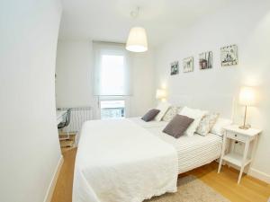 Ένα ή περισσότερα κρεβάτια σε δωμάτιο στο Donosti Deluxe by Luxe San Sebastian