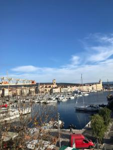 a marina with a bunch of boats in the water at Accostage Vieux-Port - Appartements & Parking en option in La Ciotat