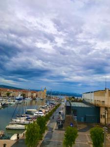 a group of boats parked in a marina at Accostage Vieux-Port - Appartements & Parking en option in La Ciotat