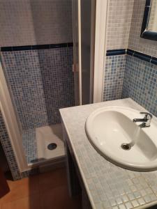 a bathroom with a sink and a shower and a toilet at FuerteSun Dunas beach in Parque Holandes +11 photos