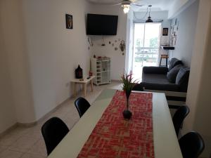 a living room with a table and a couch at Prema in San Miguel de Tucumán