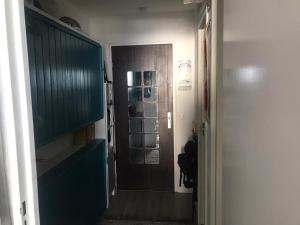 a hallway with a door to a room with a hallway at Mon studio pour 4 à Val Claret ! in Tignes