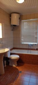 A bathroom at Anilio Rooms