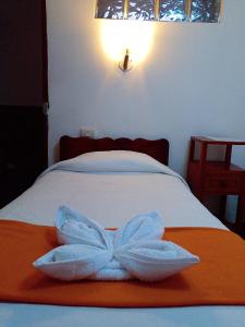 Voodi või voodid majutusasutuse Hostal Tu Hogar toas