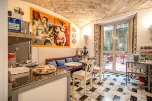 a kitchen with a table and a dining room at Nakissa Inn in Rome