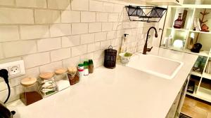 a kitchen counter top with a sink and a counter top at Peace and quiet in Kammon