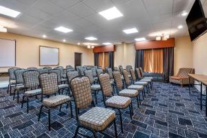 a room with a bunch of chairs and a screen at Best Western Plus Flagler Beach Area Inn & Suites in Palm Coast +18 photos