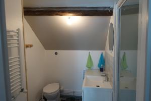 a bathroom with a sink and a toilet at Tout un 2eme étage à 300 mètres de la mer, chez l'habitant ! in Fécamp