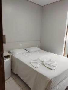 Postel nebo postele na pokoji v ubytování MFG Hotel