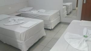 Postel nebo postele na pokoji v ubytování MFG Hotel
