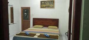 Letto o letti in una camera di Dinimuthu Rest Inn