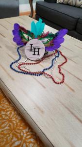 a necklace on top of a wooden table at The Lafayette House in Mobile