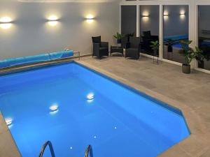 Swimming pool sa o malapit sa 8 person holiday home in Ebeltoft