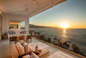 a living room with a view of the ocean at Casa Elevar at Orchid in Puerto Vallarta