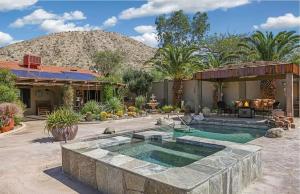 a house with a swimming pool in a yard at Dessert Hot springs / Palm Springs in Desert Hot Springs