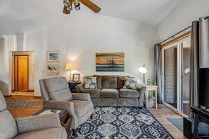 a living room with a couch and a chair at Three Capes Cottage in Pacific City
