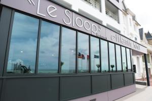 a store front with a lot of windows at Atlantic Hôtel & Spa in Les Sables-d'Olonne