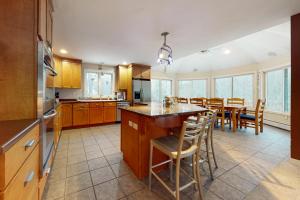 a kitchen and dining room with a table and chairs at The Ski Haus in Jackson