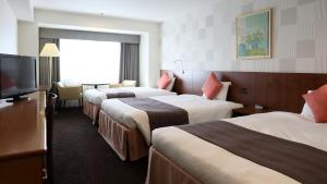 Postel nebo postele na pokoji v ubytování Loisir Hotel Toyohashi