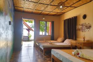 Postel nebo postele na pokoji v ubytování Mecaja Beach House
