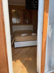 A bed or beds in a room at Villa Castello only room