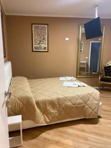 A bed or beds in a room at Villa Castello only room