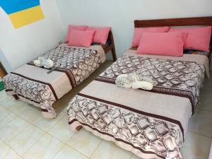 Postel nebo postele na pokoji v ubytování Hadefe Cottages