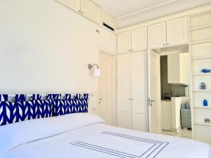 מיטה או מיטות בחדר ב-Blu Acquaviva