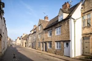 an empty street in an old town at The Cottage in Cirencester