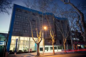 a building with a street light in front of it at Regency Way Montevideo Hotel in Montevideo